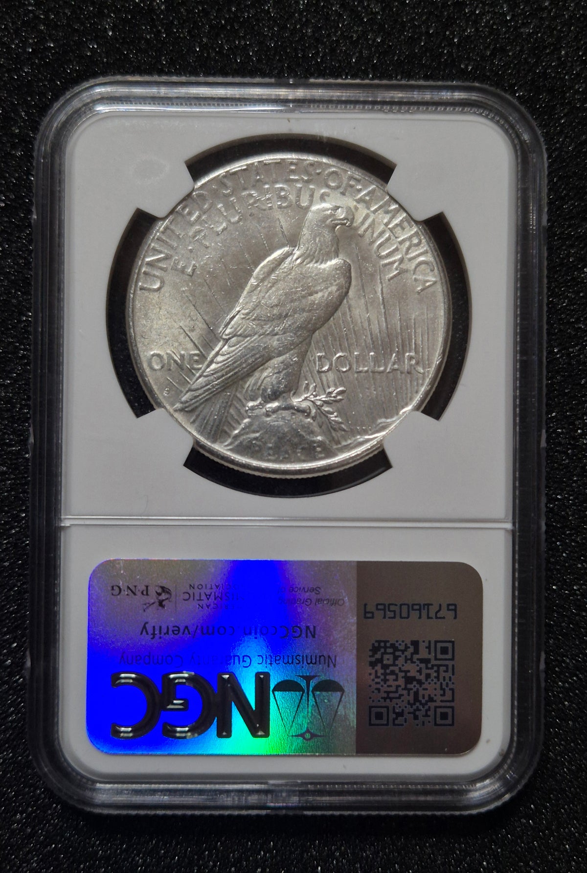 1923 Peace Dollar - Brilliant Uncirculated, with Rare Inked Bag Fragment. Certified by NGC.
