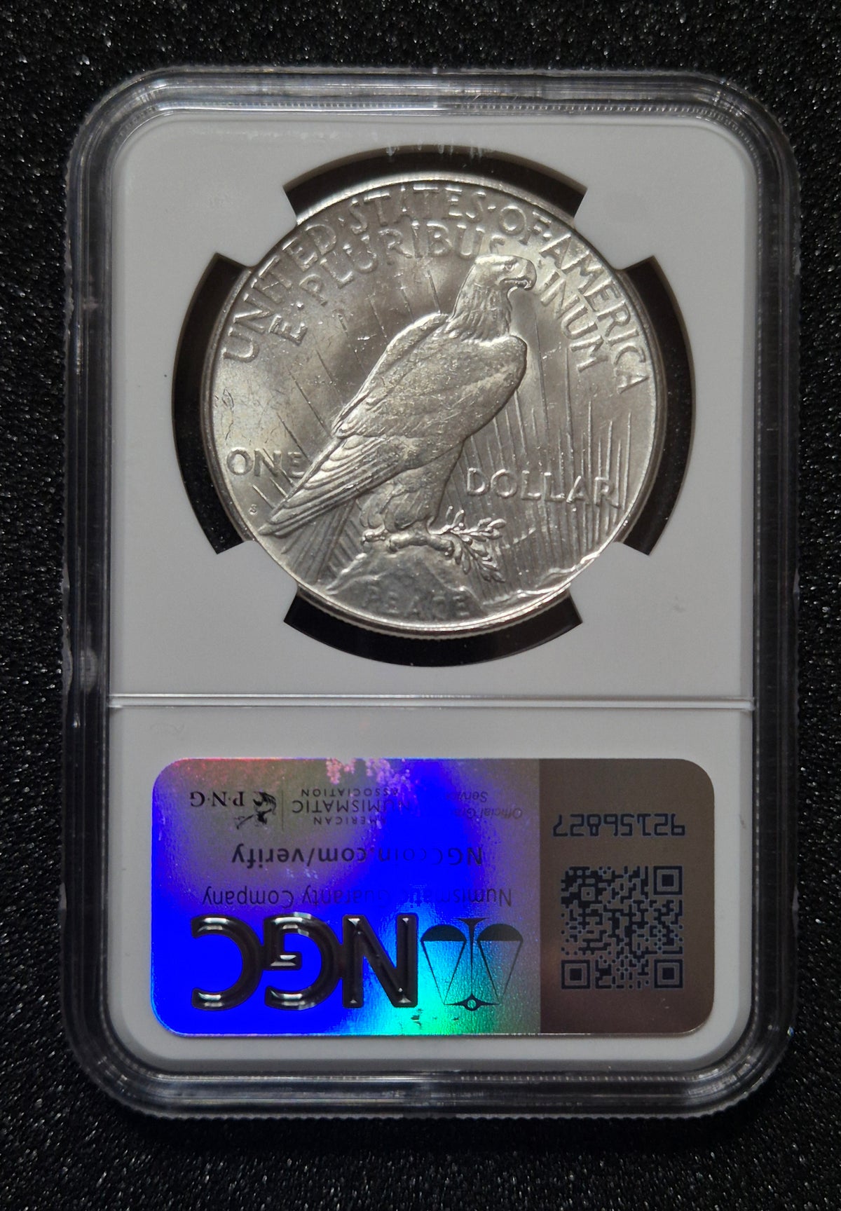 1923 Peace Dollar - Brilliant Uncirculated, with Bag Fragment. Certified by NGC.